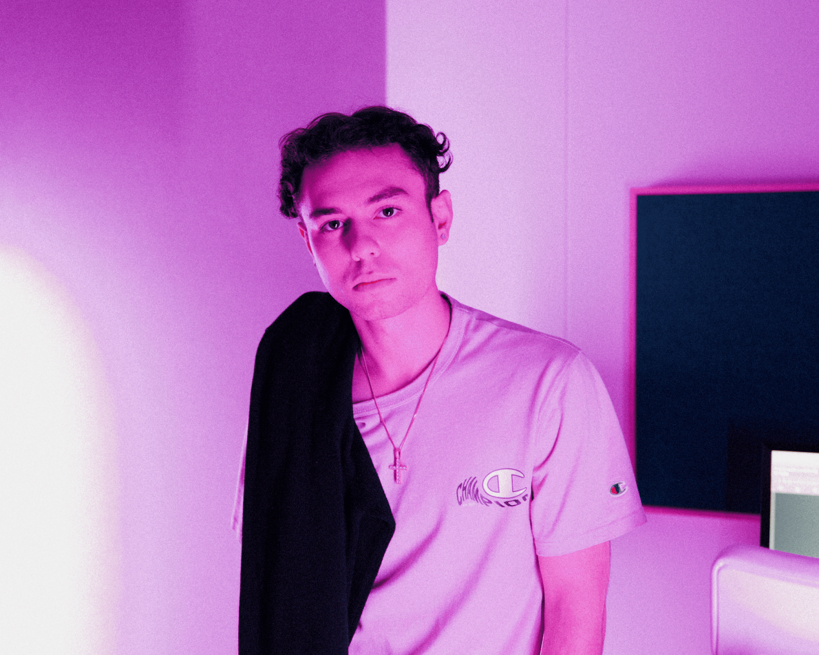 pic of the young musician, Christos. He's pale with curly brown hair and an alternative fashion